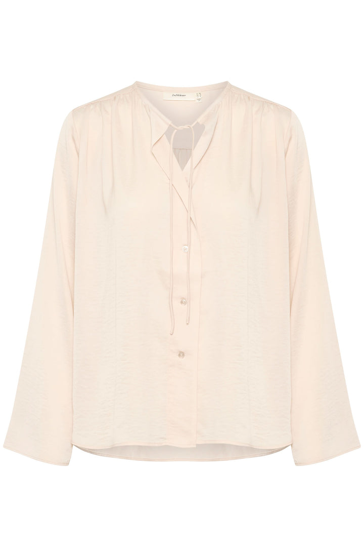 Blouse Mato en polyester recyclé, coupe classique, manches longues, encolure nouée, couleur beige clair.