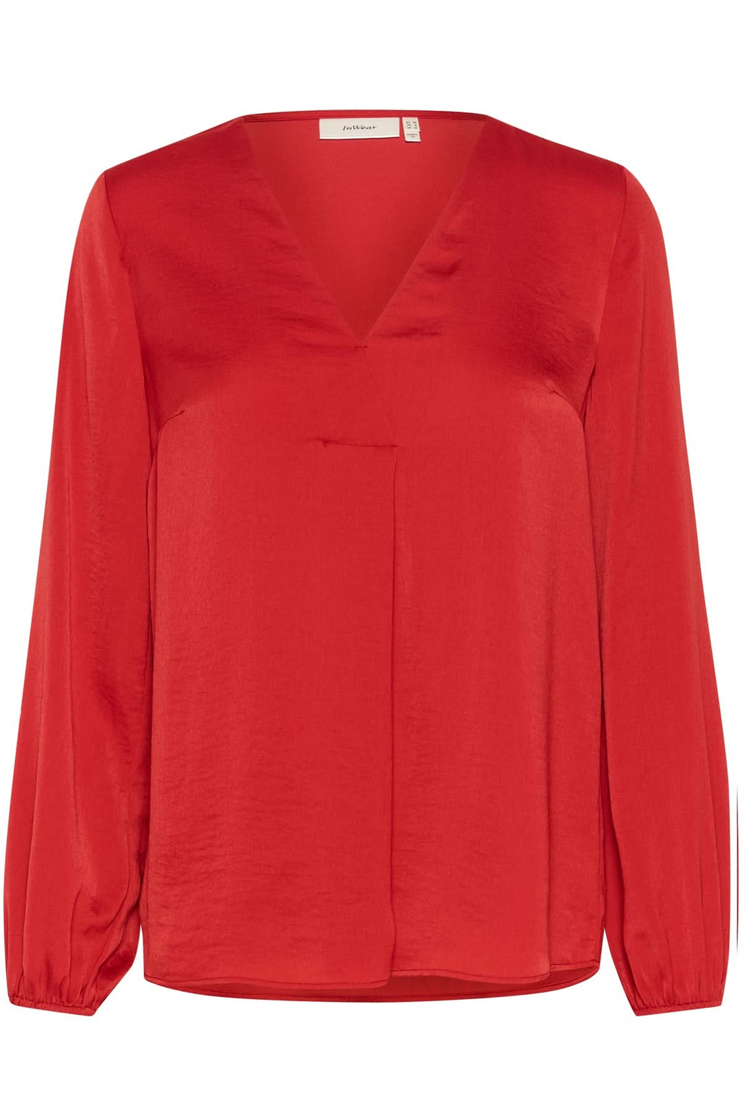 Blouse col en V Rinda rouge, coupe ample, manches longues avec poignets ajustés, style élégant et moderne.