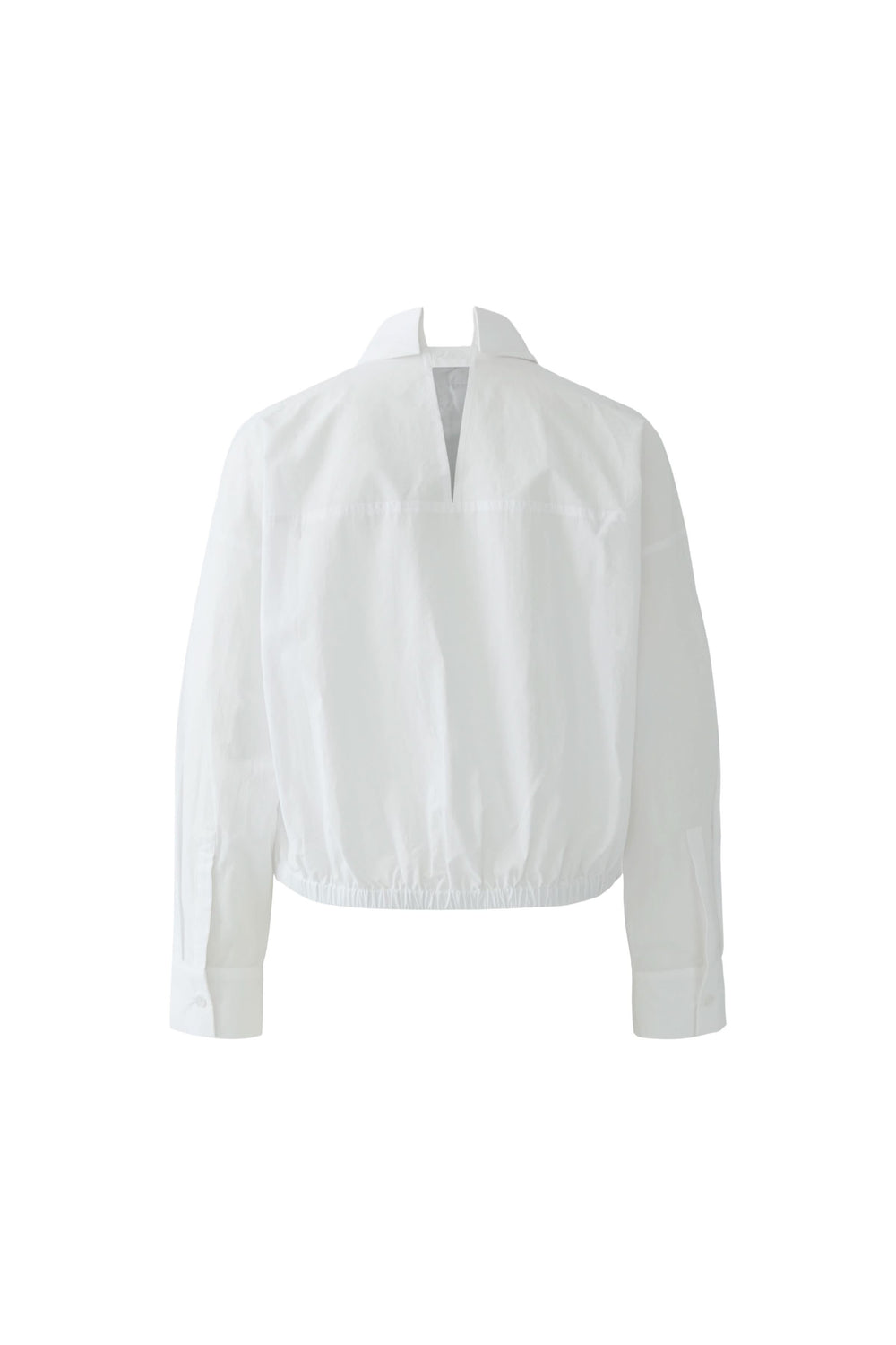 Blouse coupe moderne avec col chemise et base élastiquée, silhouette ample, idéale pour bureau et look contemporain.