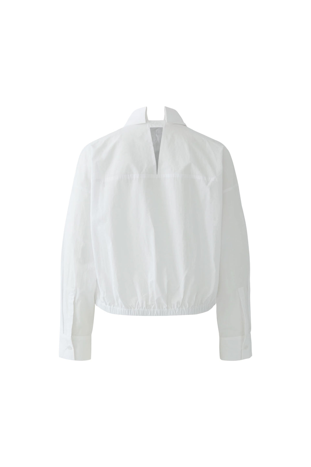 Blouse coupe moderne avec col chemise et base élastiquée, silhouette ample, idéale pour bureau et look contemporain.