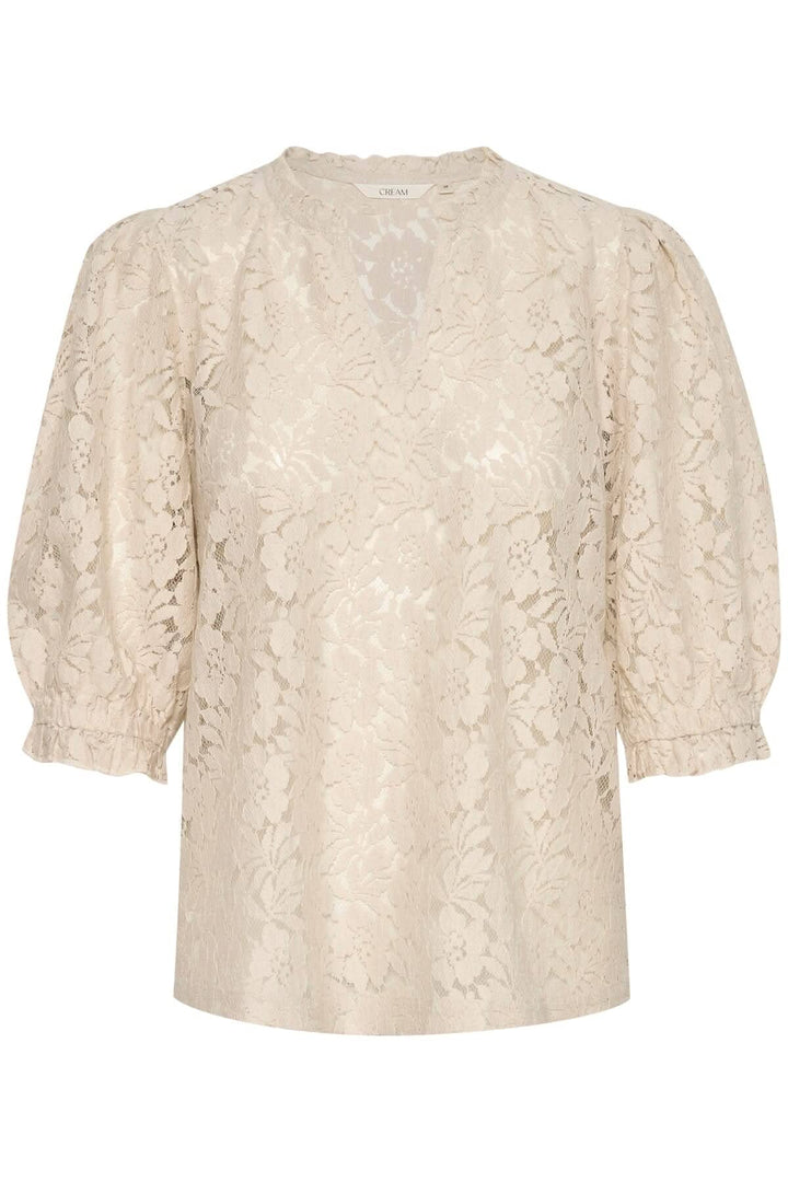 Blouse de Kaspis en dentelle beige avec manches ballon et coupe A, idéale pour le travail ou les sorties entre amis.