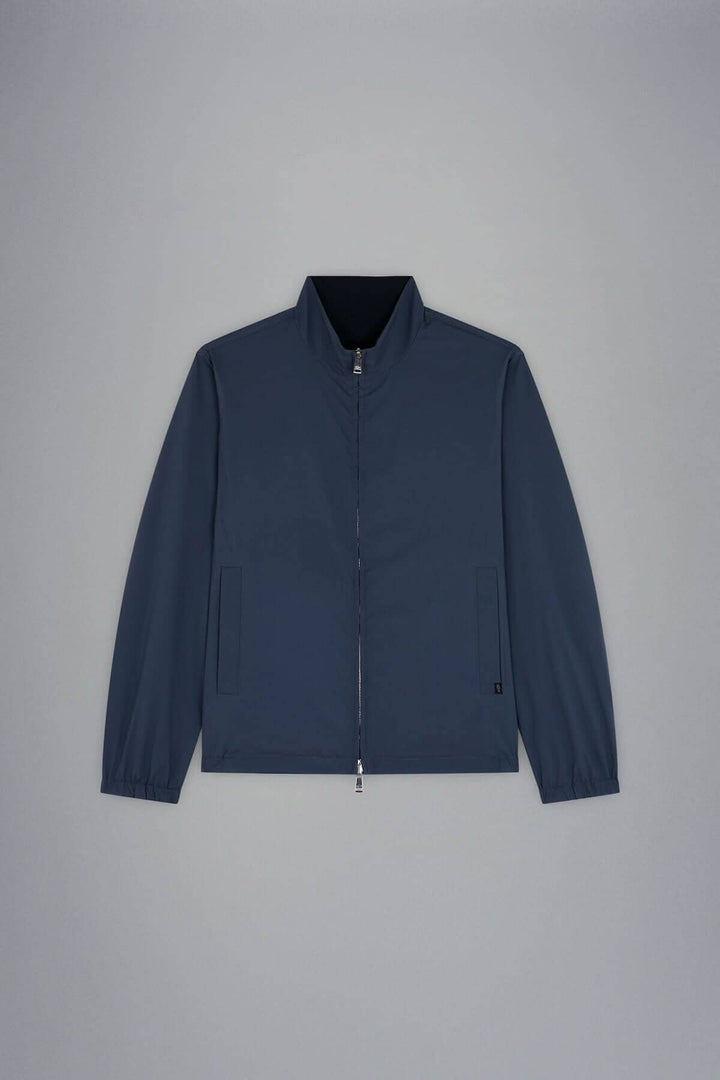 Blouse imperméable réversible en bleu marine, idéale pour un style polyvalent en toutes saisons.