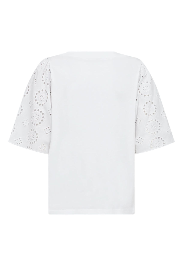 Blouse blanche à manches brodées, coupe ample, en coton biologique pour un style moderne.