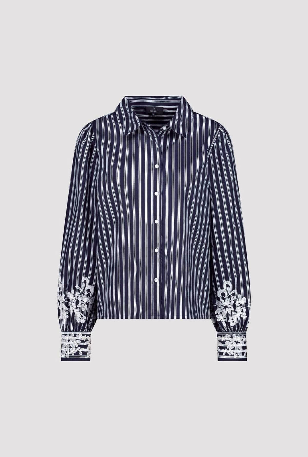 Blouse à rayures avec broderies florales aux poignets, coupe élégante et col classique.
