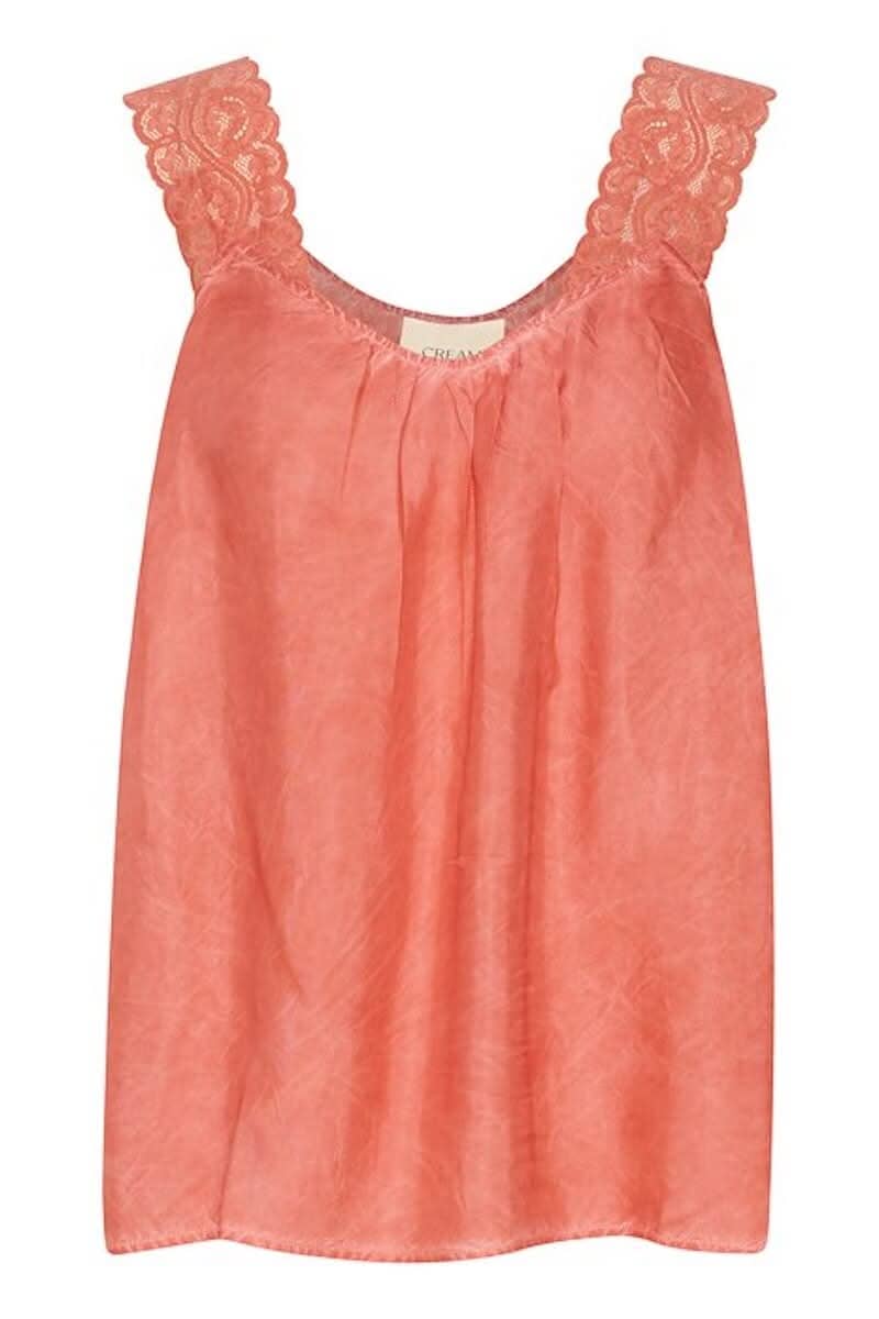 Camisole rose en viscose avec bretelles larges en dentelle, encolure ronde et coupe régulière.