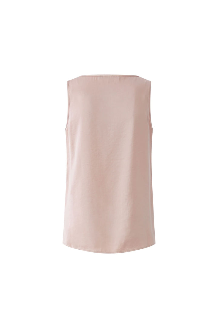 Camisole fluide sans manches avec coupe droite et encolure arrondie, idéale pour superposer sous une veste ou cardigan.
