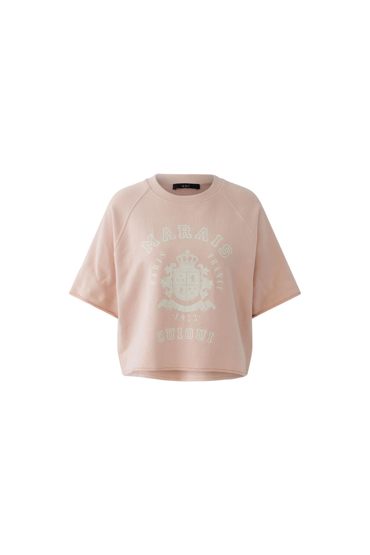 Chandail imprimé graphique rétro à manches courtes, coupe ample et légèrement raccourcie, idéal pour un look casual moderne.