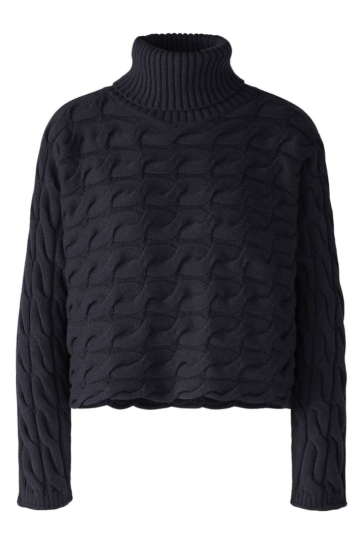 Col roulé en tricot torsadé noir à manches longues, parfait pour un look chic et moderne cet hiver.