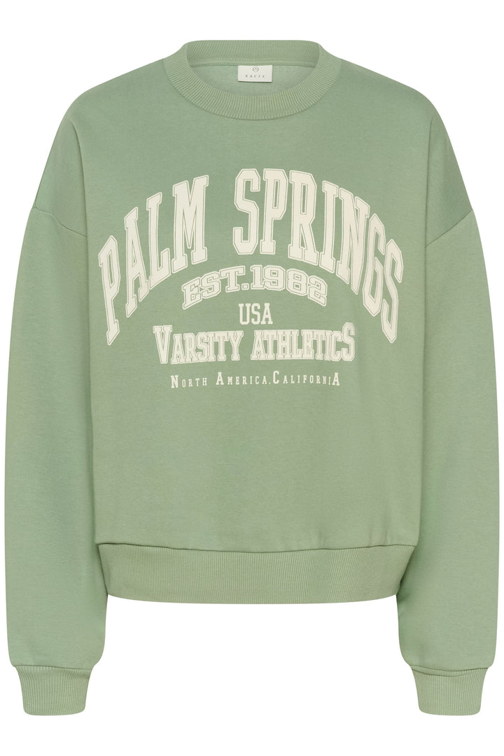 Coton ouaté Sussi, style universitaire décontracté, coupe ample, motif imprimé "Palm Springs" sur le devant, manches longues.