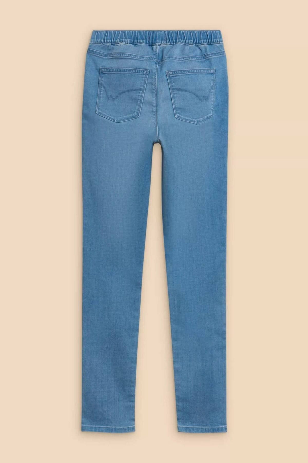 Back view of Janey jeans, featuring a comfortable elastic waistband and fitted design in light blue.