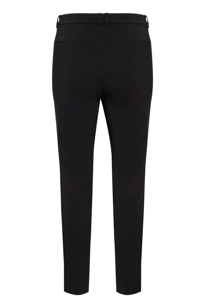 Pantalon Ziggi noir, coupe ajustée, poches zippées, tissu coton confortable.