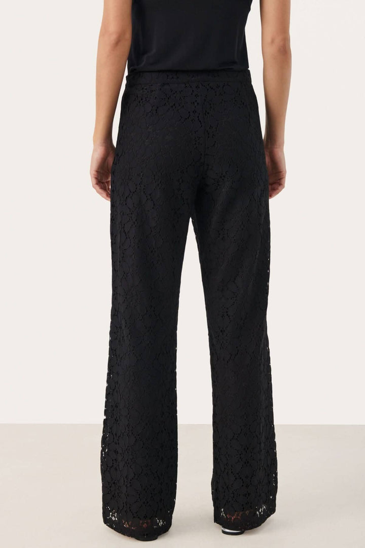 Pantalon de dentelle noir habillé, coupe classique, jambe droite, vue arrière, taille régulière.