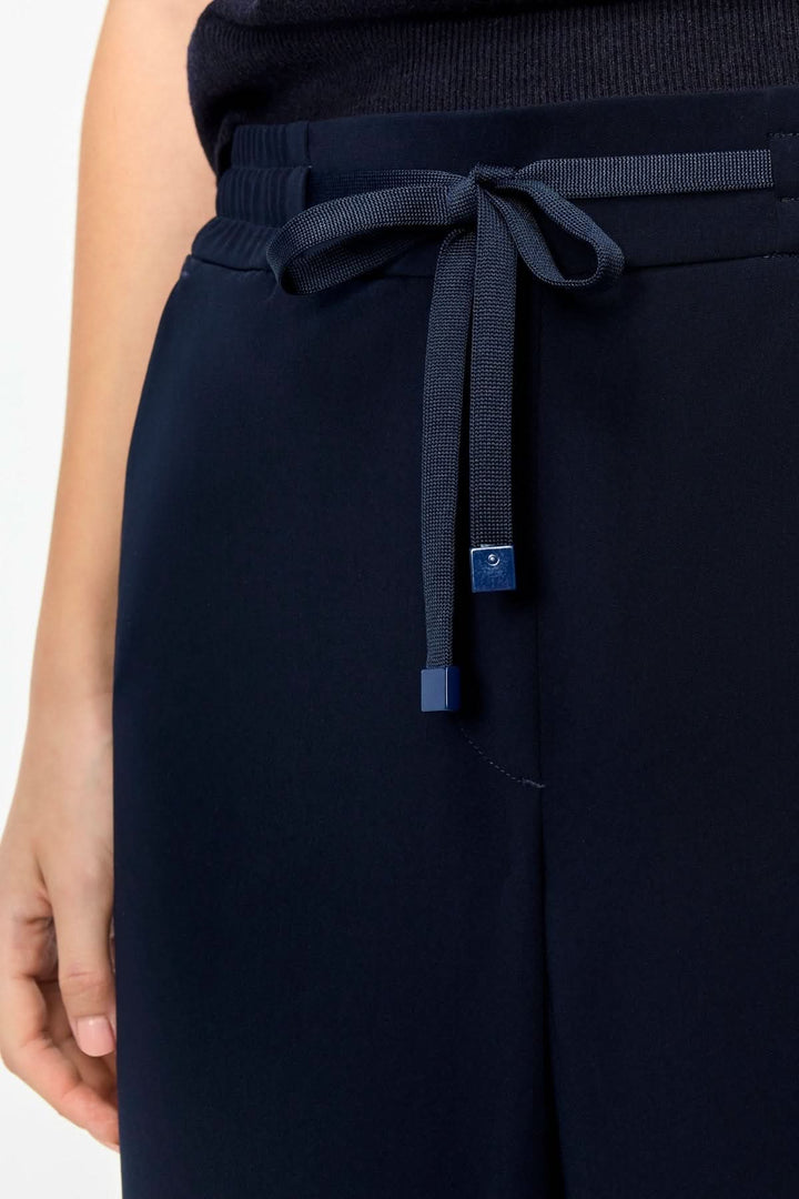 Pantalon fluide CHRISTY avec taille élastique et cordon ajustable, coupe droite ample, idéal pour un style élégant et confortable.