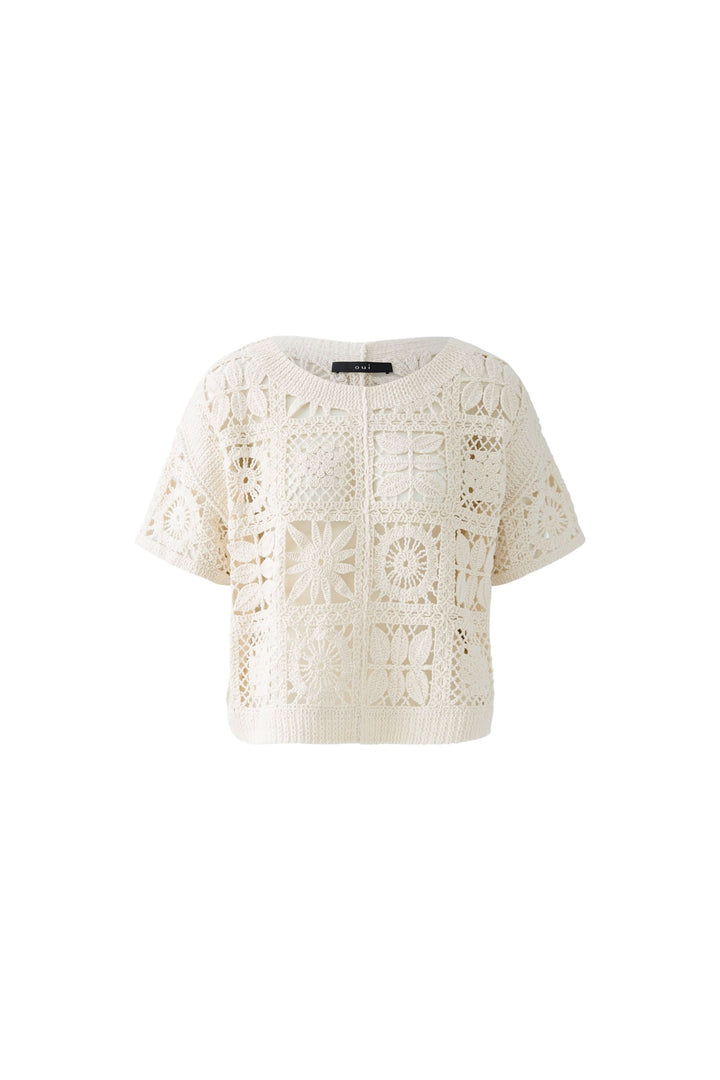 T-shirt crocheté à motifs géométriques, coupe courte, idéal pour un look bohème chic estivale.