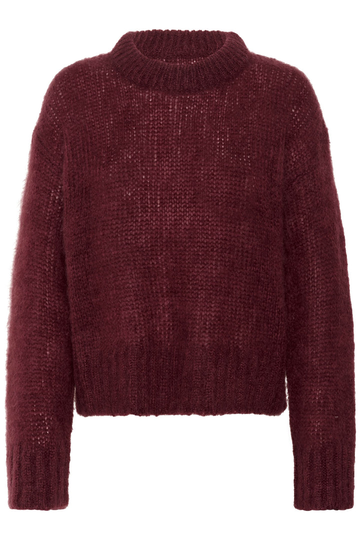 Tricot Sile à col rond, coupe ample, maille duveteuse, couleur bordeaux, parfait pour un look cosy et moderne.