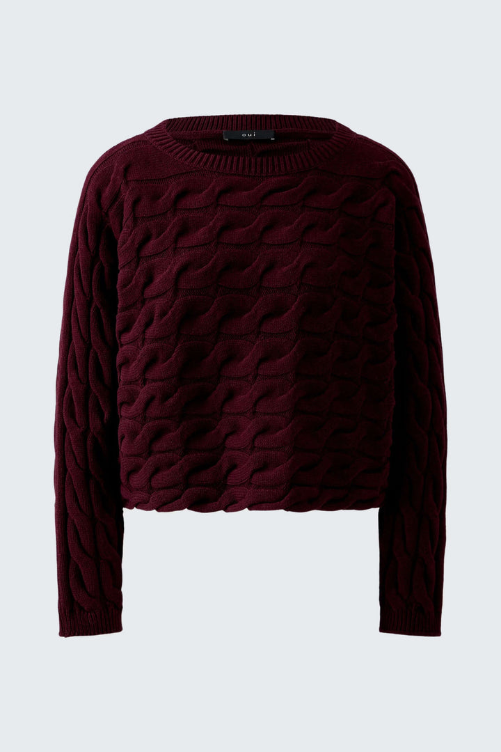 Tricot Sirah motif torsadé, coupe carrée, col bateau moderne, coton doux et volumineux. Élégance et confort dans un tricot unique.