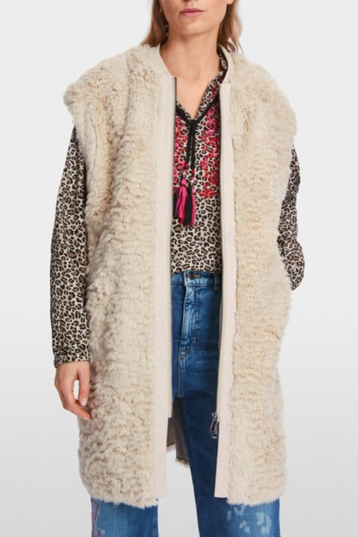 Veste longue en fourrure bouclée avec fermeture éclair et col ton sur ton, modèle ample, parfaite pour la superposition.