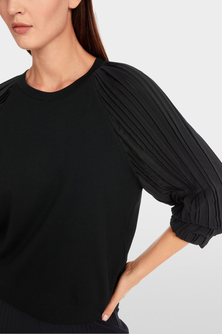 Blouse unie avec manches plissées