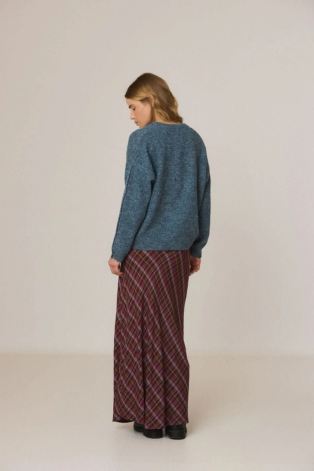 Women's V-neck knit sweater with decorative buttons, front view Indi & cold