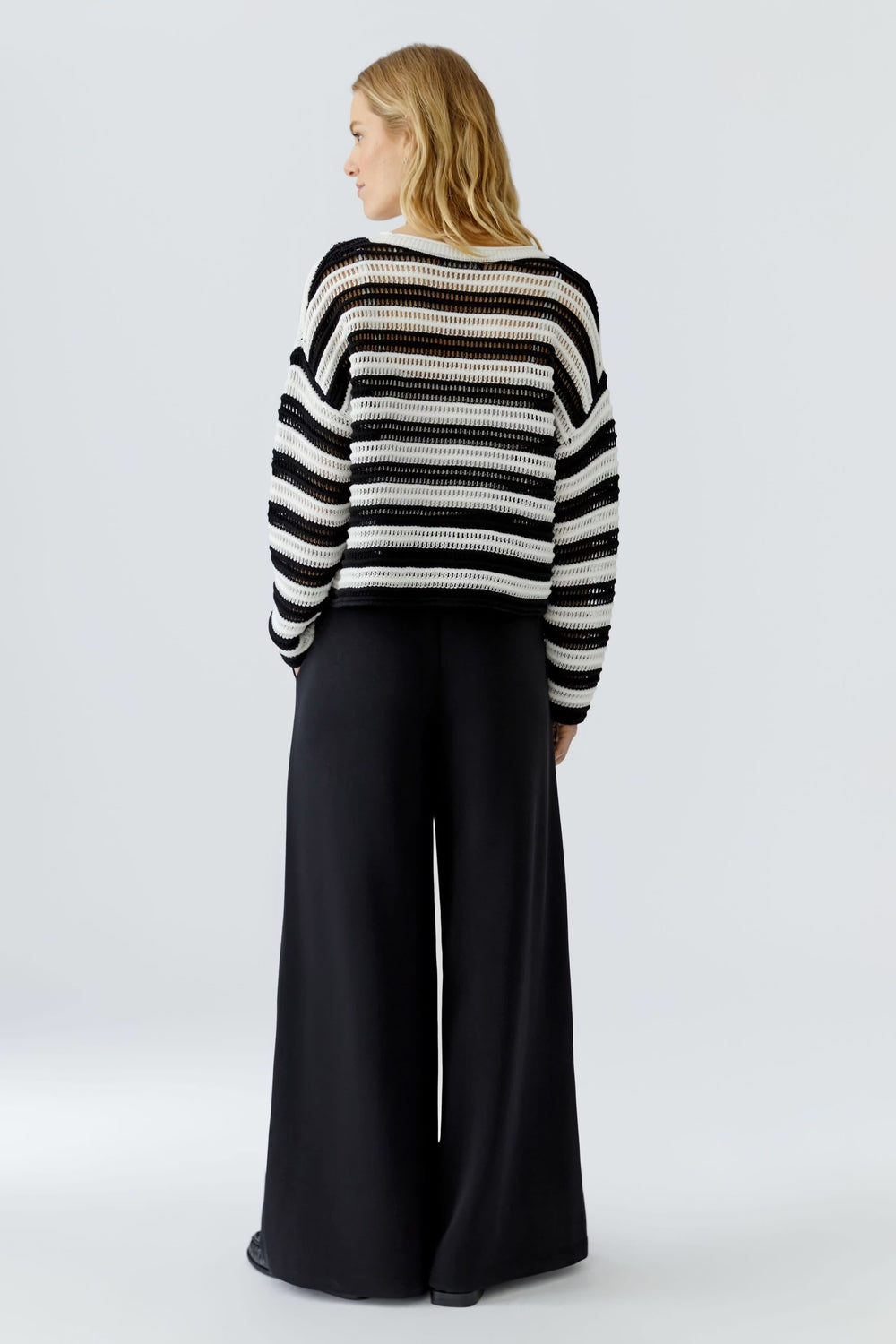 Side view of a multicolored, openwork striped women's sweater Oui - Valérie Simon