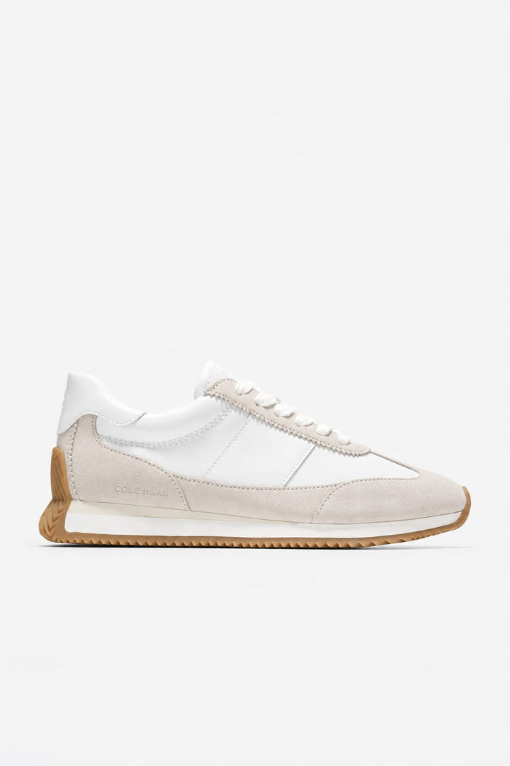 Side view of the Davie Runner leather and suede dress shoes for women by Cole Haan