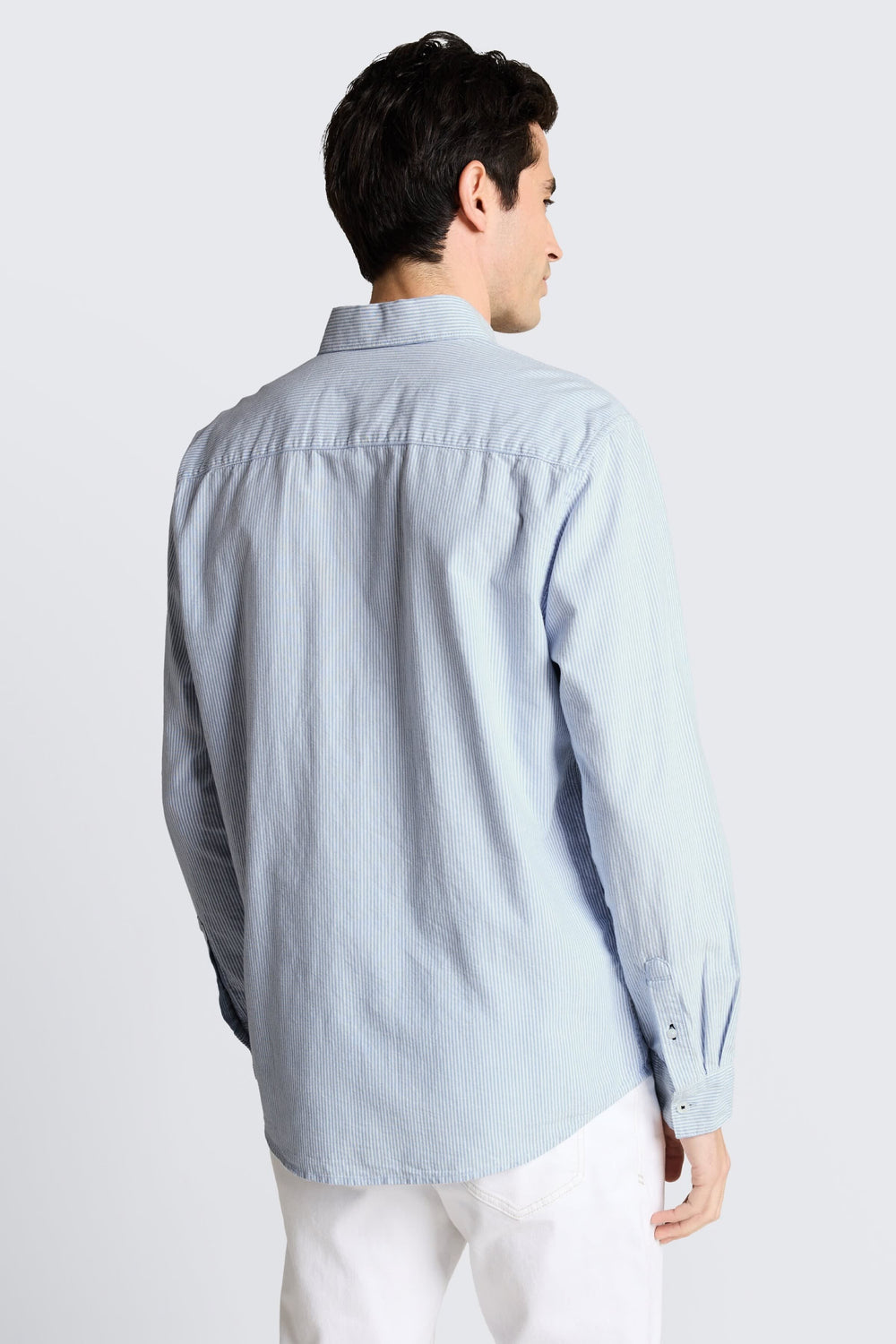 Detailed view of the Tom Tailor men's blue striped casual shirt with distinctive logo - Valérie Simon