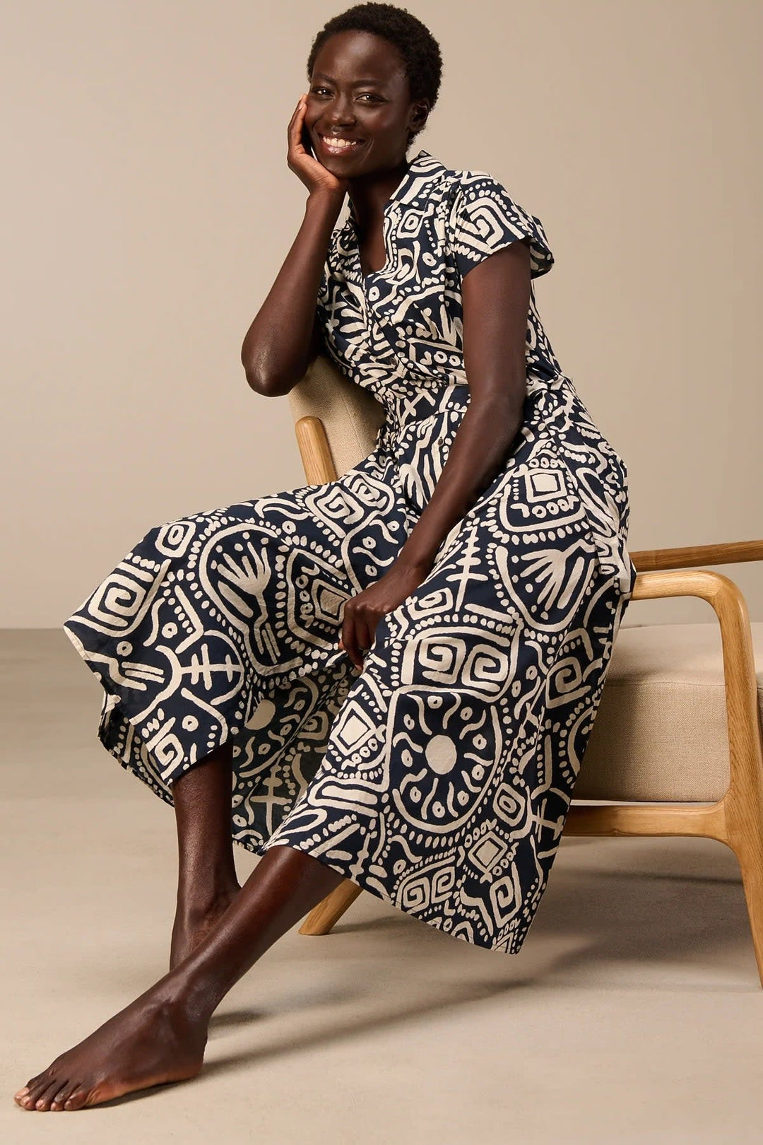 Back view of the red Nile-print maxi dress for women with a belt at Size - Valérie Simon