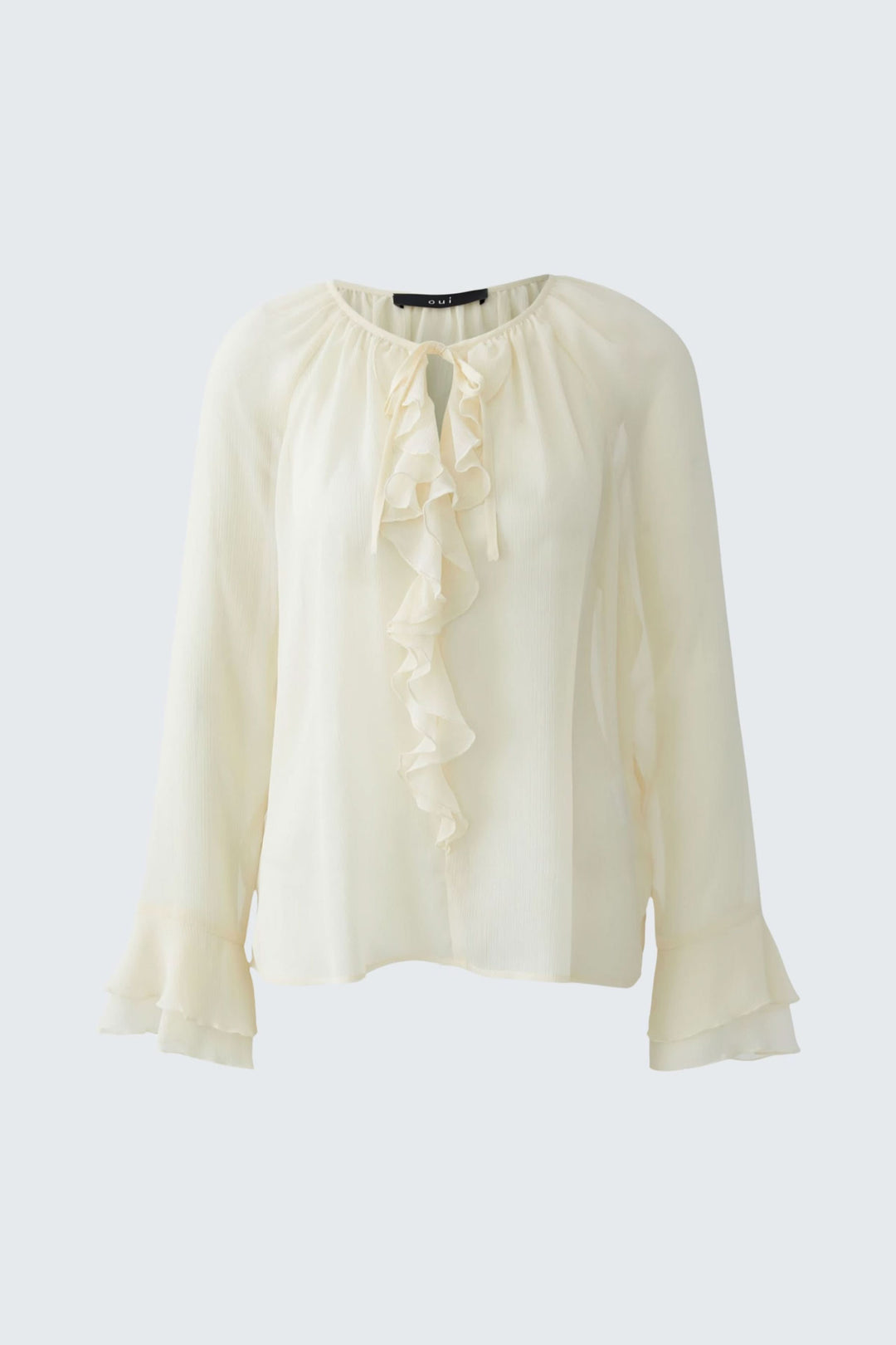 Blouse fluide à volants et lien au col en tissu léger, idéale pour un look chic et romantique, décris moi le produit en français.