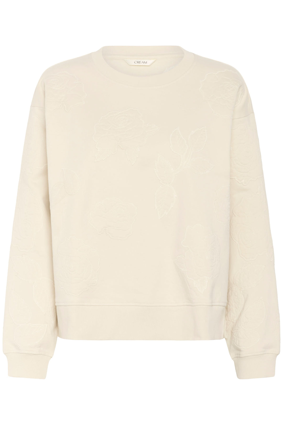 Coton ouaté Josie clair avec broderies florales ton sur ton, style élégant et confortable pour tenues décontractées.