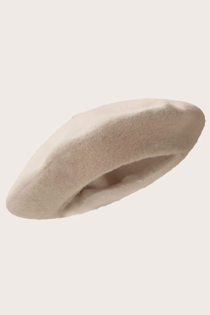 Chapeau Anett en laine douce, béret élégant au design classique, couleur beige, pour une touche féminine.