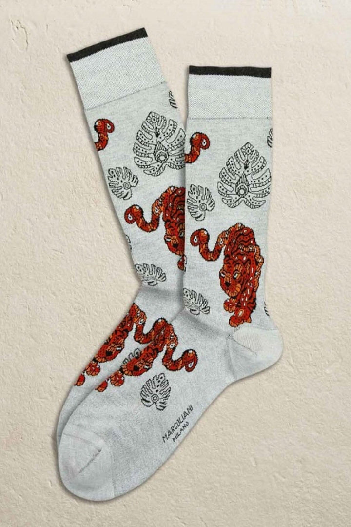 Chaussettes italiennes Marcoliani en coton avec imprimé lion et motifs stylisés, modernes et colorés.