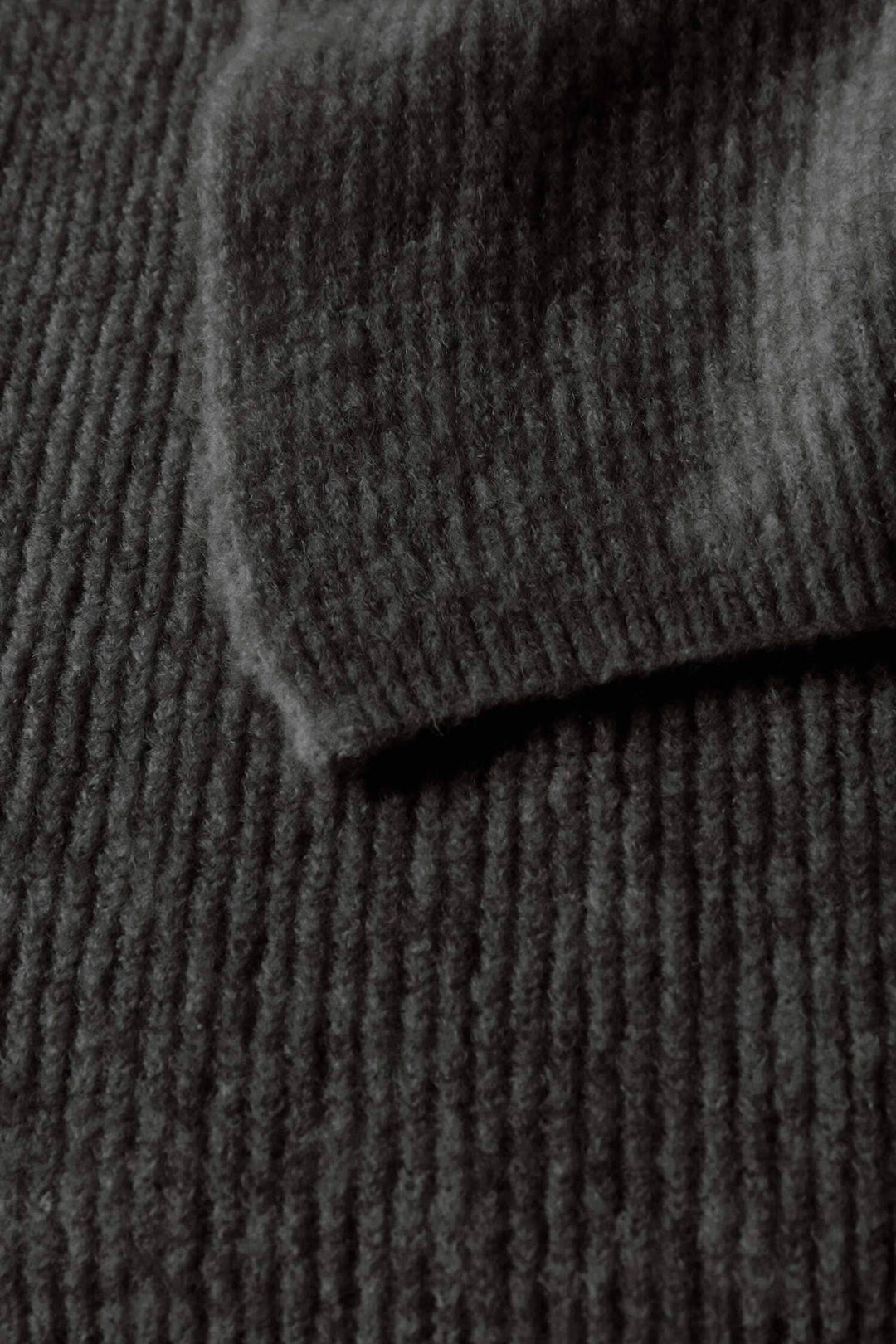 Texture close-up of Foulard Solla fabric in dark color, showcasing its soft knit material and classic cut.