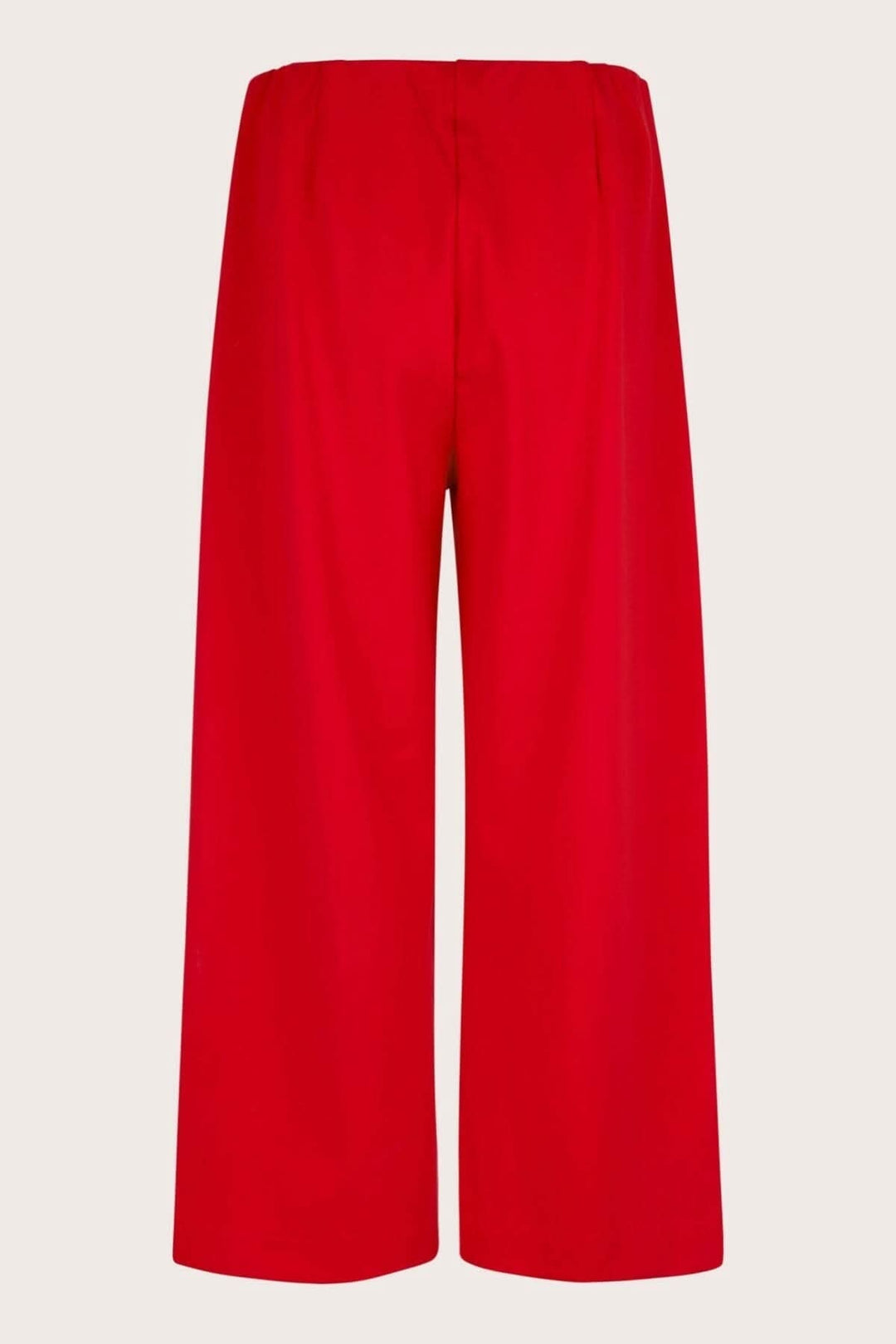 Pantalon en jersey Piri, rouge, avec taille élastique et plis arrière, coupé court et large.