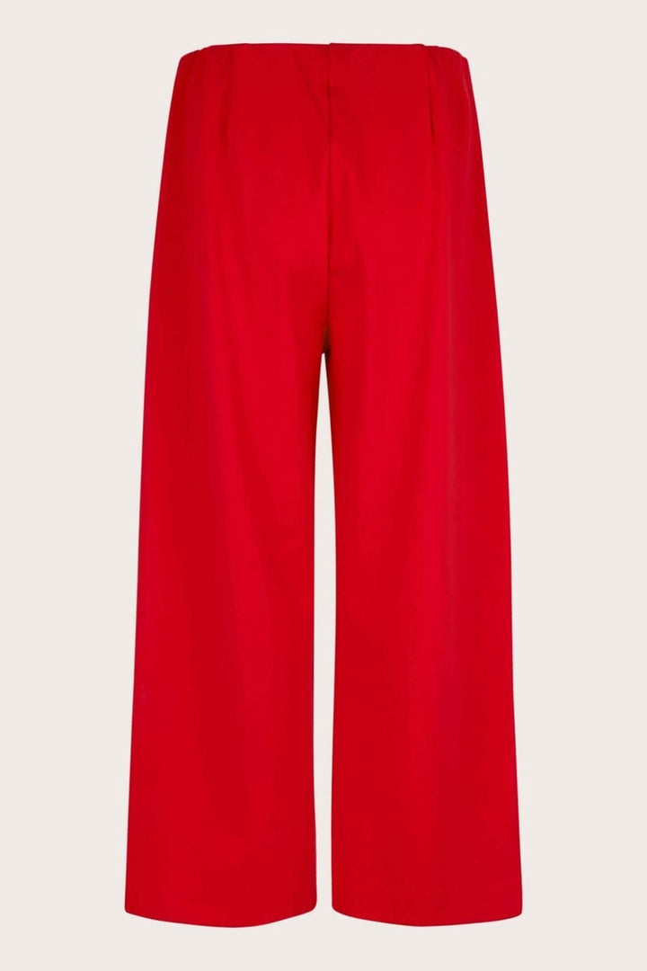 Pantalon en jersey Piri, rouge, avec taille élastique et plis arrière, coupé court et large.