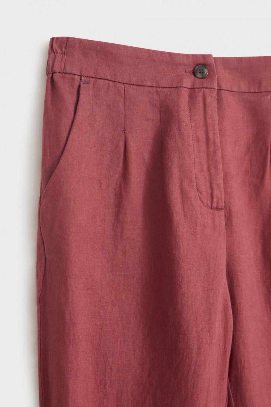 Pantalon Maddie en lin, rose, avec taille élastique, bouton et poches latérales, parfait pour temps chaud.