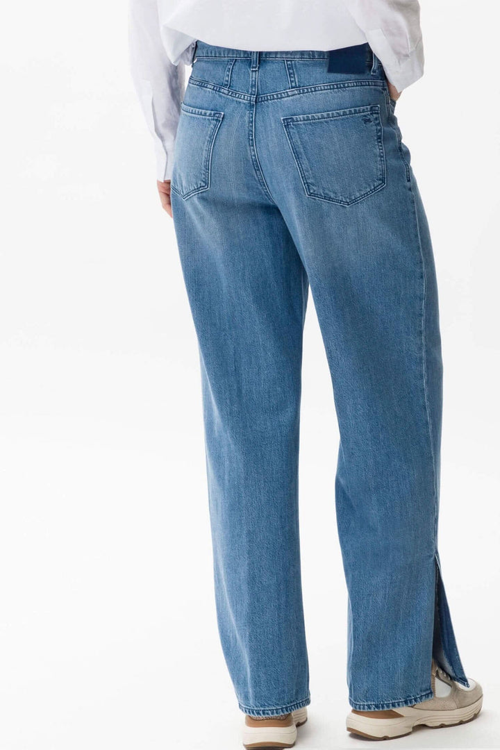 Pantalon Maine en denim bleu avec jambes évasées et fentes d&