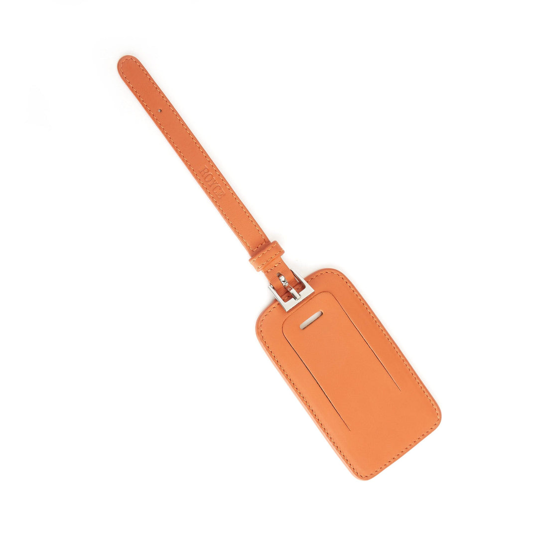 Étiquette à bagages en cuir orange, design élégant avec attache pour voyage en toute sécurité.