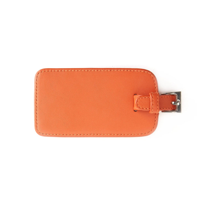 Étiquette à bagages en cuir orange, élégante et pratique pour un voyage organisé.