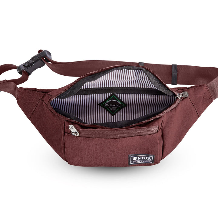 Intérieur du sac à bandoulière recyclé PKG Bremner avec doublure rayée et poche zippée.